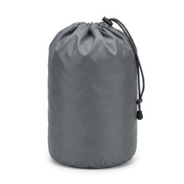 Grey drawstring storage bag for travel or camping equipment, lightweight ripstop nylon stuff sack for organizing gear isolated on white background