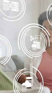 Vertical video: Woman sitting talking data closeup starting HUD rings orbiting face with servers