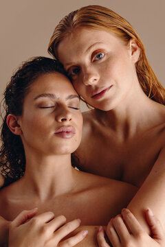 Skincare beauty portrait of two women in intimate embrace