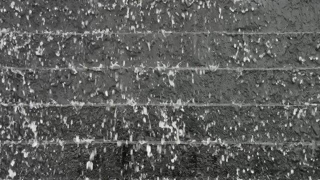 Monochrome Water Curtain Cascading Down Modern Stone Wall Background
