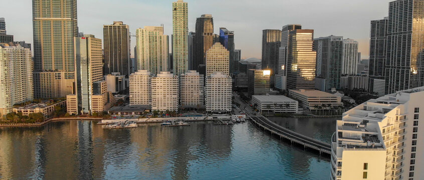 MIAMI - MARCH 31, 2018: Brickell Key and Downtown Miami aerial view. The city attracts 20 million tourists annually