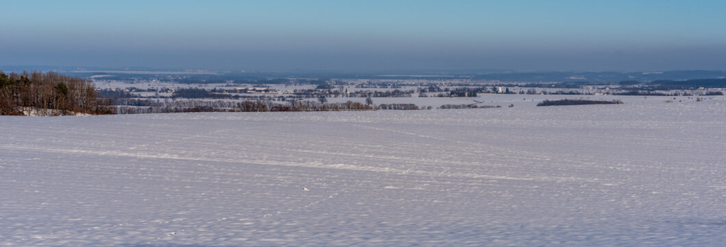 View near Jansky vrch hill in Rychlebske hory mountains above Javornik town in Czech republic during winter