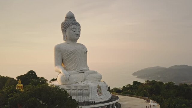 Big Buddha statue on hilltop in Phuket overlooking the Andaman Sea at sunset, a tranquil Buddhist landmark symbolizing peace, wisdom and spiritual journeys with panoramic island view. Travel Thailand