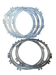 Fototapeta premium A stack of steel clutch plates for automotive automatic transmission system gear repair isolated on white background.