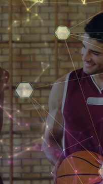Vertical video: Left player laughing, right player holding ball during sports chat with hex overlay