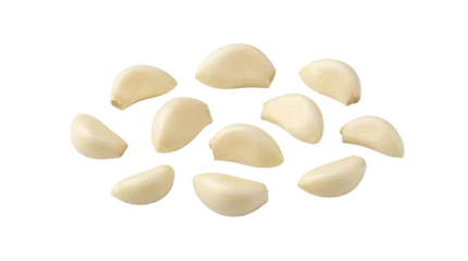 Freshly peeled garlic cloves on white background. © Nad