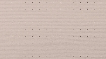 Fototapeta premium Light pink textured paper background with subtle horizontal lines and small dots.