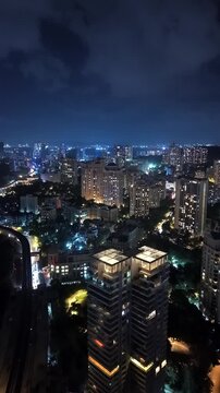 Vertical Aerial Night View of Mumbai Skyline and Illuminated Cityscape