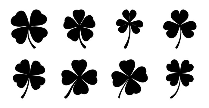 Seven black four-leaf clover icons in a row - Minimalist black four-leaf clovers arranged neatly in two rows of three and one standalone icon for luck and symbolism.