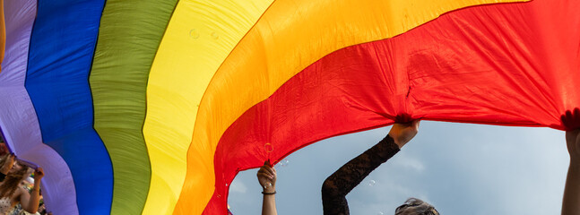 pride with rainbow flag - symbol of love and tolerance