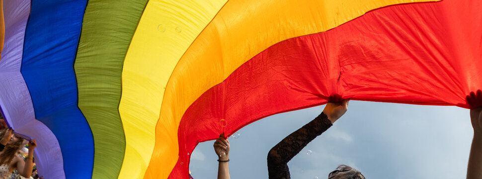 pride with rainbow flag - symbol of love and tolerance