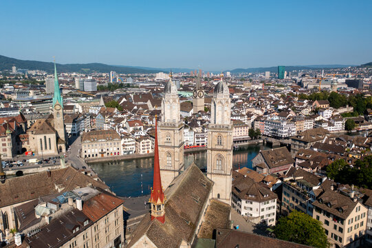 Aerial view of Grossmunster church with its iconic twin towers overlooking the historic city center and the Limmat river in Zurich, Zurich, Switzerland.