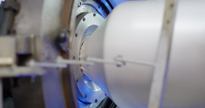 Close up of an industrial machine component rotating on a central axis