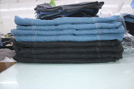 Folded Blue and Black Denim Jeans Stack