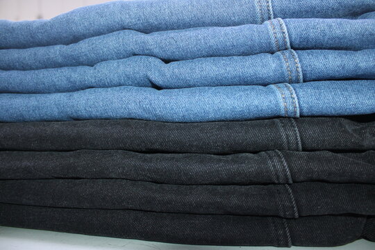 Folded Blue and Black Denim Jeans Stack