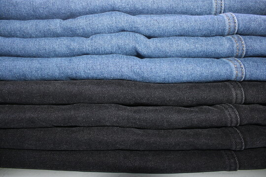 Folded Blue and Black Denim Jeans Stack