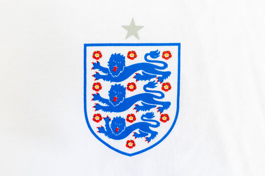 Bradford, UK June 24 2026 - Close-up of England's national football team 'Three Lions' crest with World Cup silver star on white cotton fabric.