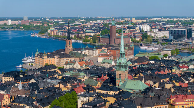 Aerial view of the historic Gamla Stan district with the German Church, Riddarholmen Church, and City Hall overlooking the waterways in Stockholm, Stockholm County, Sweden.