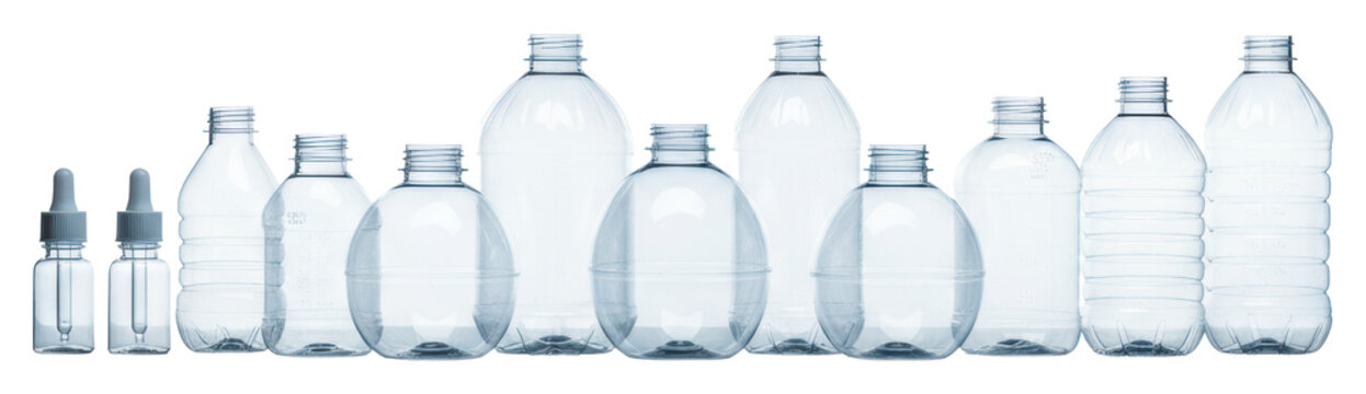 eleven clear pet plastic bottles with a subtle blue tint, showcasing diverse industrial forms and detailed structures, lined on a transparent studio background. concept of industrial packaging design