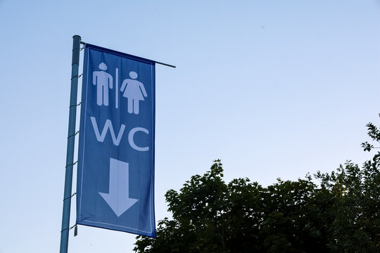 Kiel, Germany - 19. June 2026: WC sign indicating direction for public toilet facilities