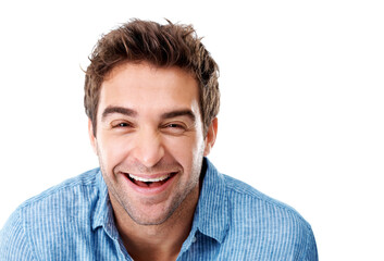 Fototapeta premium Laugh, confident and portrait of man in studio with positive attitude for comedy, funny or joke. Happy, good mood and male person with pride for comic humor or reaction on white background by space.