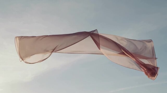 Floating translucent pale-pink hemmed cloth responding to gusts, twisting and stretching across sky