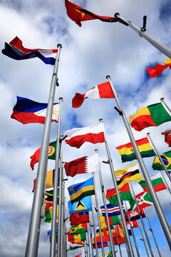 Flags of many countries gathering for global finance, security, and international cooperation, vertical