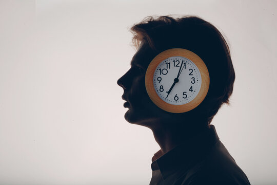 Circadian rhythm inner clock and human biorhythms concept. Day and night sleep and wake. Clock in male head.