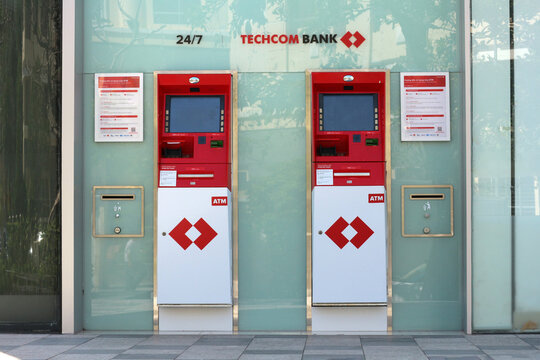NHA TRANG, VIETNAM - JANUARY 26, 2026: A close-up horizontal view of two Techcombank corporate automated teller machines (ATM) on a city street.