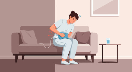 Fototapeta premium Woman Experiencing Pain with Heating Pad for Abdominal Comfort and Relief