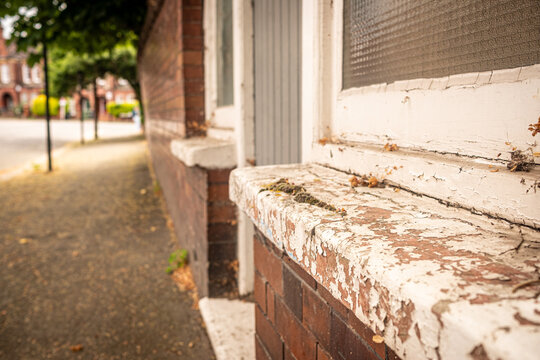 LONDON - neglected house windowsill with peeling paint