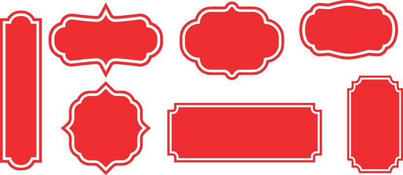 A classic set of red vintage frame labels with elegant white borders isolated on a plain background.