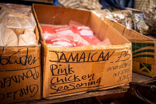 LONDON - Jamaican Chicken Seasoning &ndash; Box of Jamaican pink chicken seasoning at a market stall in Brixton.