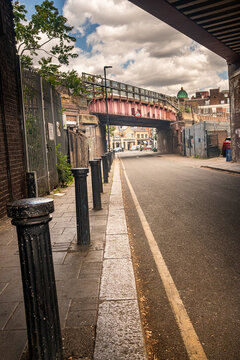 LONDON - Brixton Street &ndash; Quiet residential street with railway bridge and leading lines in Brixton.