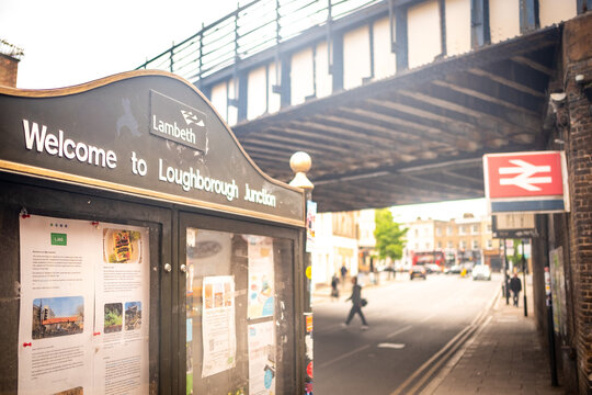 LONDON -  Loughborough Junction &ndash; Welcome sign and community notice board under the railway bridge in Loughborough Junction.