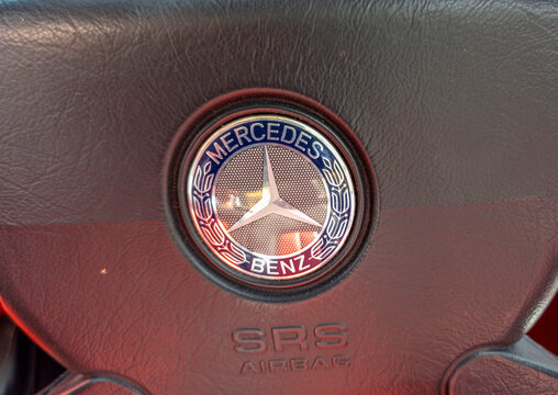 TAVERNES BLANQUES, SPAIN - JUNE 14, 2026.Dashboard view showcasing leather steering wheel and instrument cluster in classic Mercedes Benz SLK roadster during daytime drive