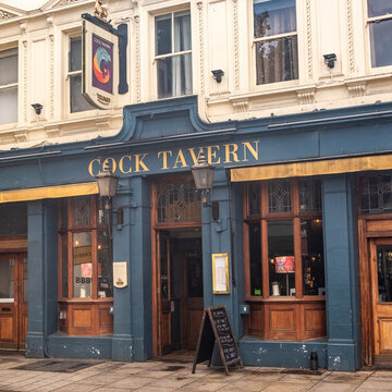 LONDON - The Cock Tavern Fulham &ndash; Traditional blue-fronted pub on Fulham Broadway.