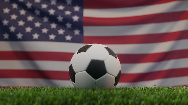 Centered soccer ball on grass before large United States flag for American football supporters
