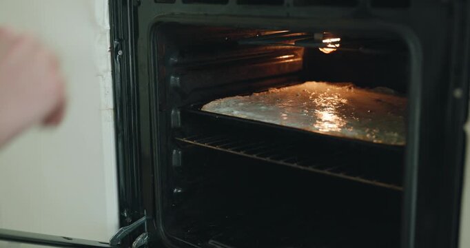 Caucasian man make potato pie. Single male is cooking at kitchen at home. 4K 10-bit