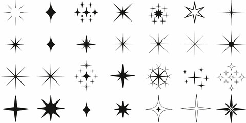 A collection of black star shapes and sparkles on a white background astral celestial constellation © Pabitra