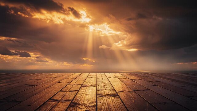 Golden sunset radiates sunbeams through dramatic clouds above serene wooden floor, capturing essence of natures beauty