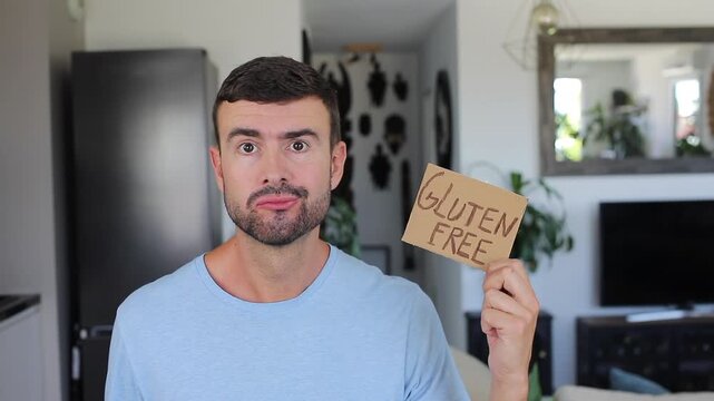 Frustrated Celiac Man Holding Handwritten Gluten Free Sign with Anxiety Finding out there exist bread without gluten