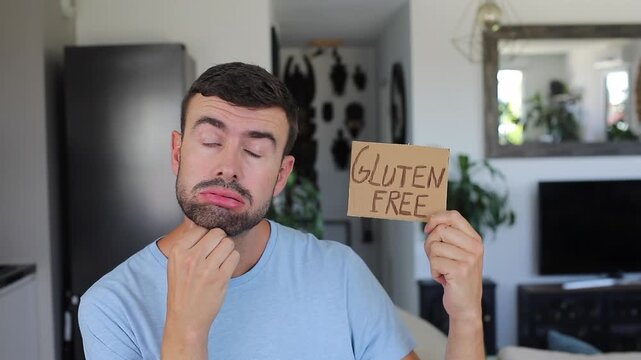 Frustrated Celiac Man Holding Handwritten Gluten Free Sign Showing Diet Anxiety