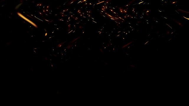Fiery sparks flying on top of a black screen, an abstraction.