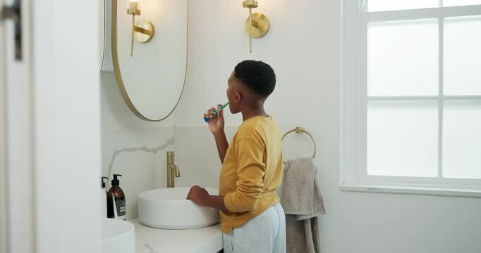 Mirror, toothbrush and basin with black child in bathroom for brushing teeth, cleaning and dental. Self care, oral hygiene and gum health with kid in home for plaque prevention, mouth and wellness