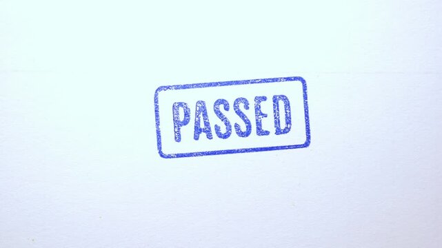 Blue "PASSED" stamp applied directly onto official document profile to show approval.
