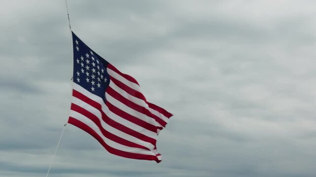 US flag at fort sumter waving in a strong wind slow motion
