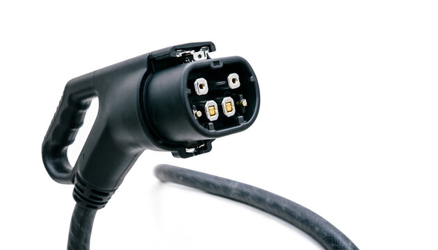 Close-up EV charging plug with solar energy infrastructure represented through realistic equipment, charging flap open, white background.
