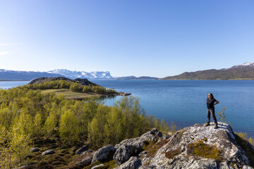 Obraz premium Woman on Kvaenangen fjord in northern Norway, Troms county
