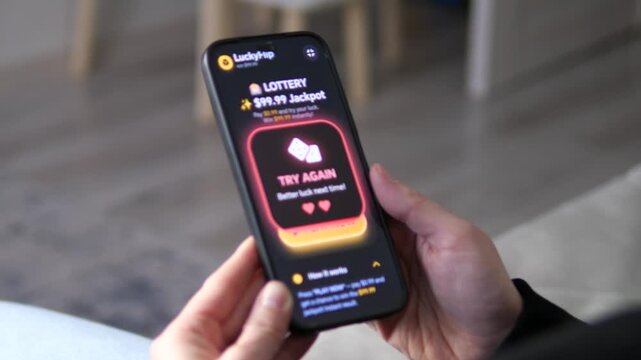 User tapping the glowing yellow PLAY NOW button to try their luck at a 99.99 dollars jackpot. The action represents a leap of faith. Ideal for behavioral finance, risk-taking apps, and gamified